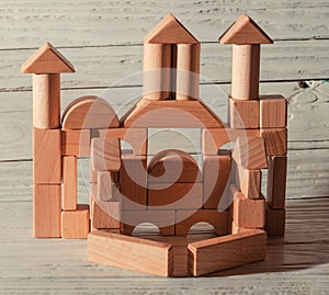 Children`s wooden designer from blocks of a different form