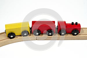 Children`s wooden locomotive toy with wagons