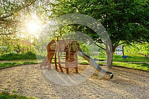 Children`s wooden playground recreation area at public park