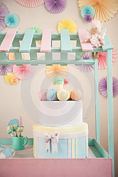 Children`s wooden and textile toys. Toy trolley with ice cream and cupcakes. Handmade textile ice cream close-up and copy space. B