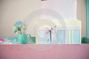 Children`s wooden and textile toys. Toy trolley with ice cream and cupcakes. Handmade textile ice cream close-up and copy space. B