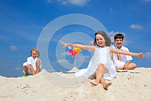 Children in sand on beach