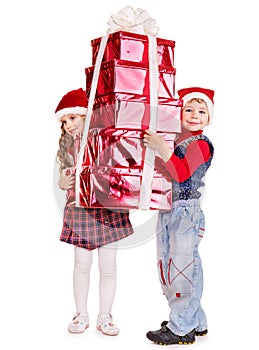 Children in Santa hat with gift box .