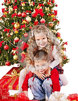 Children in Santa hat with gift box .