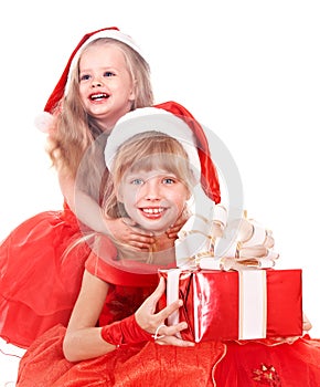 Children in santa hat holding gift box.