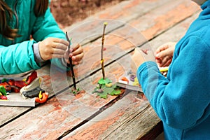 Children sculpt from plasticine.