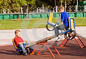 Children on a seesaw photo