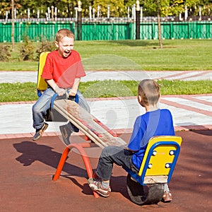 Children on a seesaw photo