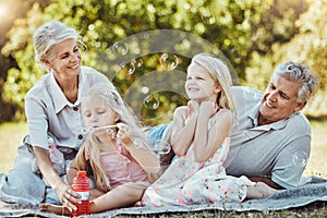 Children, seniors or bonding with bubbles in park, home nature picnic or house garden in fun, silly or goofy activity