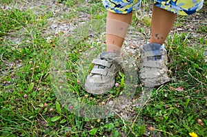 children shoes covered in mud