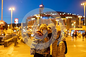 Children, siblings, standing in front of the Bullring Arenas