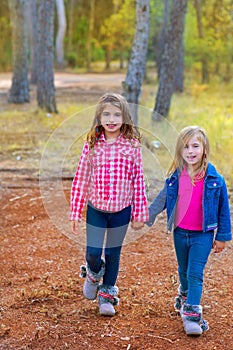 Children sister girls walking at the pine forest