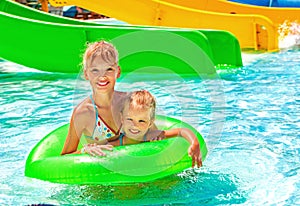 Children sitting on inflatable ring