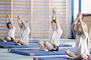Children sitting in yoga pose