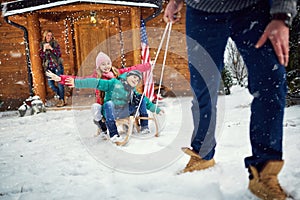 Children sledding at winter time