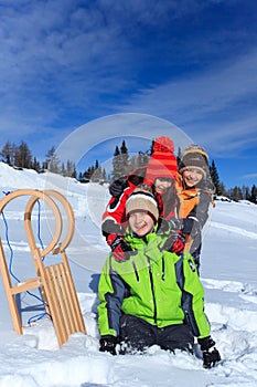 Children with sledge in Winter photo