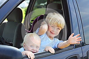 Children Smiling Out Van Window