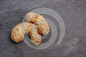 Children snacks with peanuts on wooden background photo