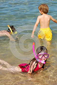 children snorkeling at beach