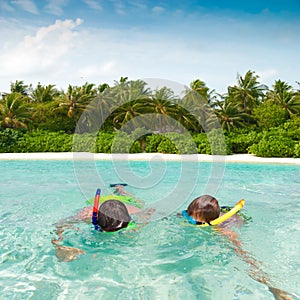 Children snorkeling in tropics