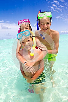 Children with snorkels in sea photo