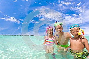 Children with snorkels in sea photo