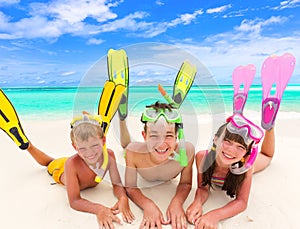 Children with snorkels by sea photo