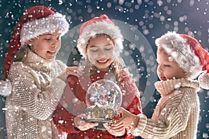 Children with snow globe