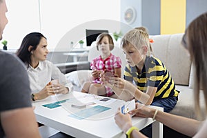 Children spend time with parents, mother entertain kids with games on holiday