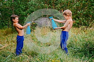 Children splash water on each other