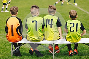 Children in Sports Team. Happy Kids in Soccer Sportswear Jersey Sitting on Soccer Football Substitute Bench