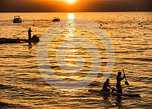 Children stand up paddling on Lake Tahoe