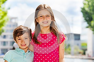 Children standing together outdoors in summer