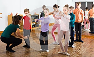 Children studying folk style dance in class