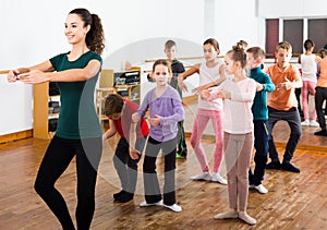 Children studying folk style dance in class