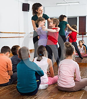 Children studying of partner dance at dance school