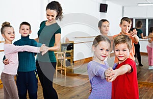 Children studying of partner dance at dance school