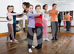 Children studying of partner dance at dance school