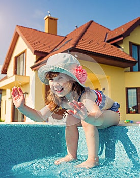 Children swim outdoors.