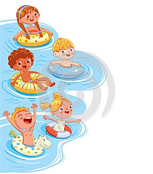 Children swim in the sea or pool on the lifebuoys and inflatable ring