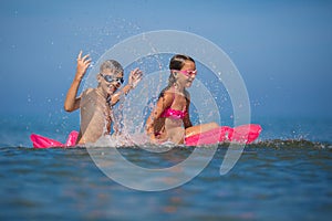 Children swimming and having fun together