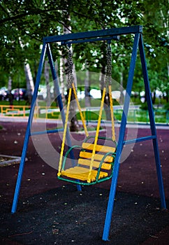 children swing on the children&#s city playground