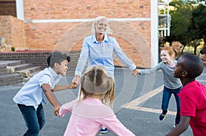 Children and teacher playing together