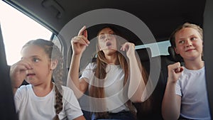 children teenagers dancing in the car on the road travel. happy family adventure a kid dream concept. friendly family