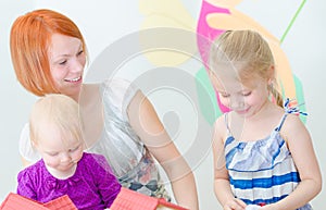 Children and their mother playing.