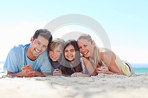 Children with their parents at the beach