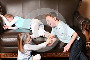 Children tickling feet