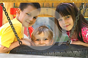 Children On A Tire Swing