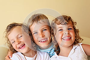 Children together in cosy, girl at left closed eye