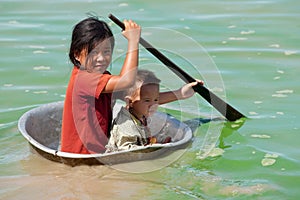 Children in the Tonle Sap lake in Cambodia